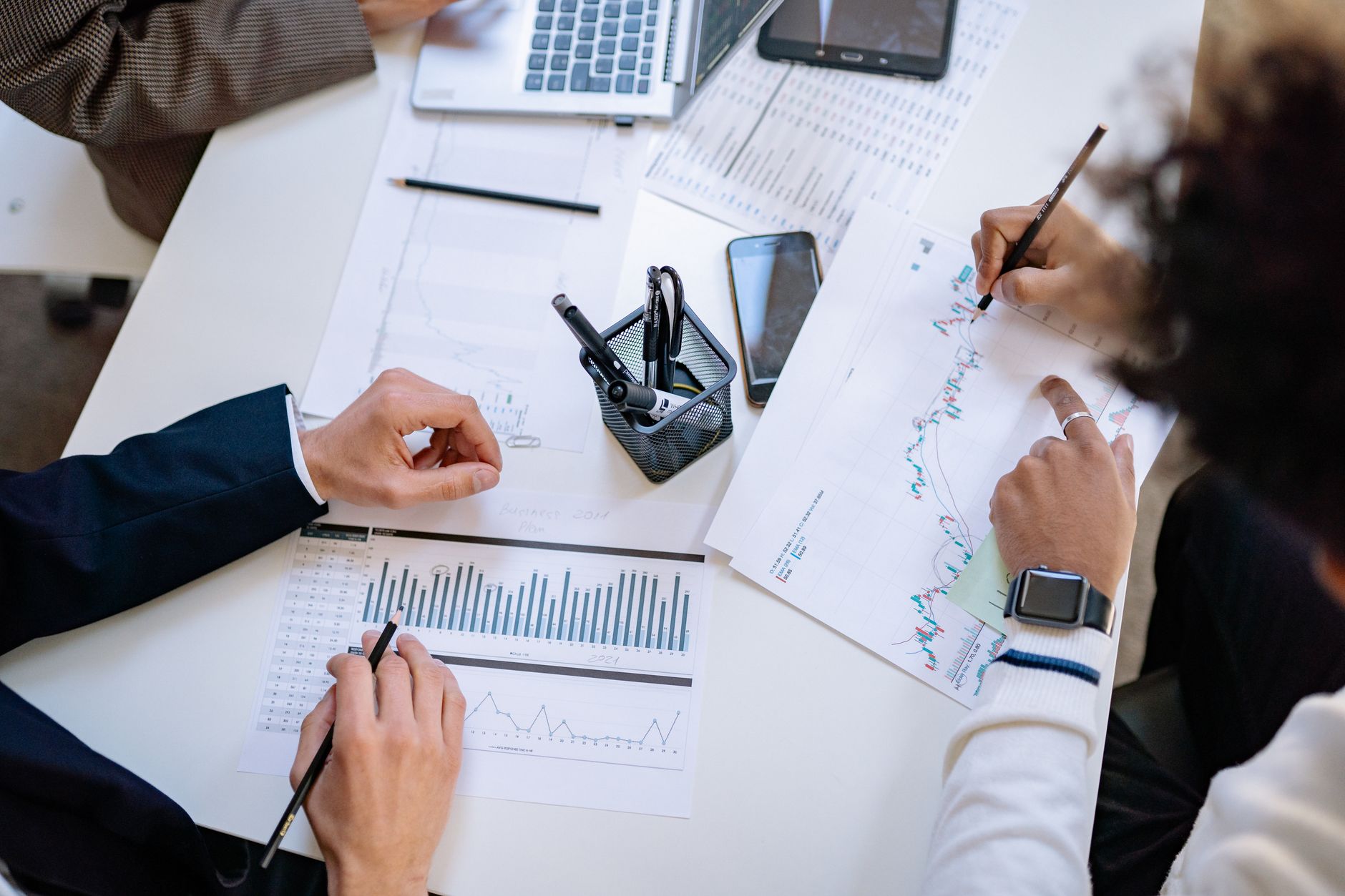 Business team reviewing charts together at a table